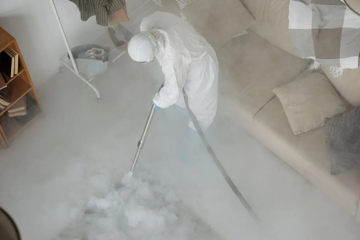 Biohazard cleanup technician in protective equipment, Bellville, OH